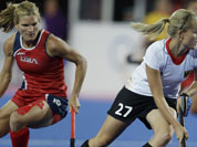 Germany`s Anke Brockmann (27) steals the ball from the United States` Katie O`Donnell (16) during the women`s hockey preliminary match at the 2012 Summer Olympics.