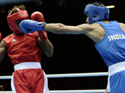 India`s Bhagwan Jai, right, connects with Andrique Allisop of the Seychelles, during men`s light 60-kg boxing at the 2012 Summer Olympics.