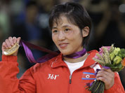 North Korea`s An Kum Ae holds her gold medal in the women`s 52-kg judo competition at the 2012 Summer Olympics.