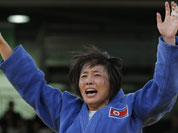 North Korea`s An Kum Ae celebrates after defeating Cuba`s Acosta Bermoy in the gold medal match in the women`s 52-kg judo competition at the 2012 Summer Olympics.