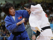 North Korea`s An Kum Ae, left, competes with Cuba`s Acosta Bermoy during the gold medal match in the women`s 52-kg judo competition at the 2012 Summer Olympics.