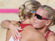 Lenka Hajeckova, right, from Czech Republic celebrates with her teammate Hana Klapalova, left, after defeating Mauritius in their Beach Volleyball match at the 2012 Summer Olympics.