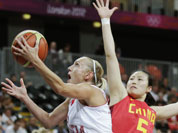 Croatia`s Andja Jelavic, left, drives to the basket against Song Xiaoyun during a women`s basketball game at the 2012 Summer Olympics.