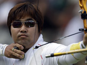 South Korea`s Im Dung-hyun shoots during an elimination round of the individual archery competition at the 2012 Summer Olympics in London. 