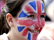 Milly Dutton, 12, of London watches a broadcast of an Olympic tennis match on a large screen at Park Live inside Olympic Park during the 2012 Summer Olympics in London.