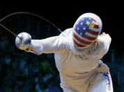 USA`s Courtney Hurley faces France`s Laura Flessel-Colovic during a women`s individual epee fencing round of 32 match at the 2012 Summer Olympics in London.
