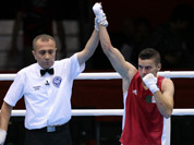 Algeria`s Samir Brahimi,  reacts after defeating Australia`s Jackson Woods in their men`s flyweight 52-kg boxing match at the 2012 Summer Olympics in London.