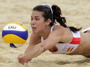 Elsa Baquerizo of Spain dives for a ball during a beach volleyball match against Argentina at the 2012 Summer Olympics.