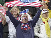 Fans cheer for the United States during a beach volleyball match against the Czech Republic at the 2012 Summer Olympics in London. 