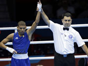 Cuba`s Yosbany Veitia Soto, reacts after defeating Australia`s Billy Ward during a light flyweight 49-kg preliminary boxing match at the 2012 Summer Olympics in London.