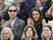 Britain`s Prince William, his wife Kate Middleton the Duchess of Cambridge, and Prince Harry,  watch the show-jumping phase of the equestrian eventing competition at the 2012 Summer Olympics at Greenwich Park in London.