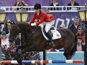 Nina Lamsam Ligon of Thailand rides her horse Butts Leon in the show-jumping phase of the equestrian eventing competition at the 2012 Summer Olympics, at Greenwich Park in London.