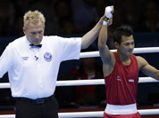 Devendro Singh Laishram, reacts after defeating Honduras` Bayron Molina Figueroa during a light flyweight 49-kg preliminary boxing match at the 2012 Summer Olympics in London.