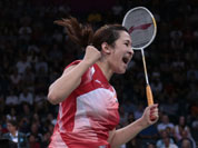 India`s Jwala Gutta jumps up after winning against Taiwan`s Cheng Wen-hsing and Chien Yu-chin, unseen, at a women`s doubles badminton match of the 2012 Summer Olympics.