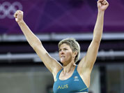 Nat Cook of Australia reacts to the crowd in a contest against Austria during a beach volleyball match at the 2012 Summer Olympics.