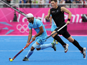 Sandeep Singh controls the ball against New Zealand during their men`s hockey preliminary round match at the 2012 Summer Olympics.