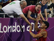 Alexander Horst of Austria reacts with fans at the end of a beach volleyball match win against Italy at the 2012 Summer Olympics in London. 