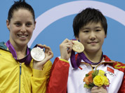 Australia`s Alicia Coutts, left, China`s Ye Shiwen, center, and the United States` Caitlin Leverenz pose with their medals for the women`s 200-meter individual medley swimming final pose at the Aquatics Centre in the Olympic Park during the 2012 Summer Olympics in London.