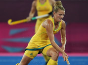 Australia`s Kobie McGurk, right, and Germany`s Christina Schuetze vie for the ball during their women`s hockey preliminary round match at the 2012 Summer Olympics in London.