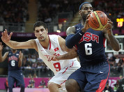 USA`s Lebron James (6) looks to pass as he is pressured by Tunisia`s Mohamed Hadidane during a men`s basketball game at the 2012 Summer Olympics in London.