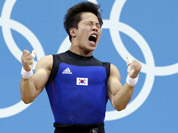 Won Jeongsik of South Korea reacts while competing during the men`s 69-kg, group A, weightlifting competition at the 2012 Summer Olympics in London.