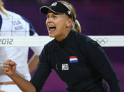 April Ross, left, of US and Marleen Van Iersel, right, from Netherlands react during the Beach Volleyball match against Netherlands at the 2012 Summer Olympics in London. 