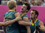 Australia`s Matthew Butturini (8) celebrates his goal with teammates during their men`s hockey preliminary match against Spain at the 2012 Summer Olympics in London. Australia won 5-0. 