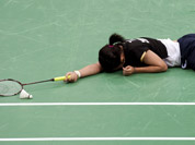 Taiwan`s Tai Tzu-ying reacts after losing a women`s singles badminton match against China`s Li Xuerui at the 2012 Summer Olympics in London.