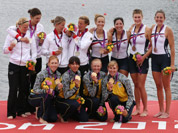Winners of the women`s rowing quadruple sculls final pose with their medals in Eton Dorney, near Windsor, England, at the 2012 Summer Olympics. Gold medal winners from the Ukraine are at bottom, silver medal winners from Germany at left, and bronze medal winners from the U.S