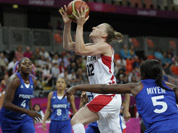 Canada`s Lizanne Murphy drives past France`s Endene Miyem during a women`s basketball game at the 2012 Summer Olympics in London.