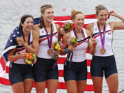 U.S. rowers Adrienne Martelli, Megan Kalmoe, Kara Kohler, and Natalie Dell display the bronze medals they won in the women`s rowing quadruple sculls in Eton Dorney, near Windsor, England, at the 2012 Summer Olympics.