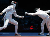 Hungary`s Geza Imre, left, competes with Morocco`s Abdelkarim El Haouari during men`s individual epee fencing at the 2012 Summer Olympics in London. 