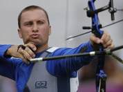Ukraine`s Viktor Ruban shoots during an elimination round of the individual archery competition at the 2012 Summer Olympics in London. 