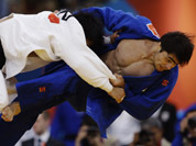 Masashi Nishiyama of Japan, left, and Chingiz Mamedov of Kyrgyzstan, compete during the men`s 90-kg judo competition at the 2012 Summer Olympics in London.