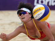 Xue Chen from China dives for a ball during the Beach Volleyball match against Greece at the 2012 Summer Olympics in London.