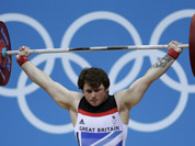 Great Britain`s Jack Oliver competes during the men`s 77-kg weightlifting competition at the 2012 Summer Olympics in London.