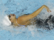 Syria`s Bayan Jumah competes in a women`s 100-meter freestyle swimming heat at the Aquatics Centre in the Olympic Park during the 2012 Summer Olympics in London.