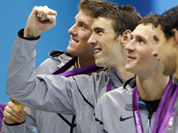 United States` Michael Phelps, center, pose with his gold medal after their win in the men`s 4 x 200-meter freestyle relay at the Aquatics Centre in the Olympic Park during the 2012 Summer Olympics in London.