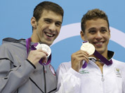 United States` Michael Phelps pose with his medal for the men`s 200-meter butterfly swimming final at the Aquatics Centre in the Olympic Park during the 2012 Summer Olympics in London.