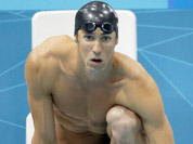 United States` Michael Phelps waits to start the final leg of the men`s 4X200-meter freestyle relay as teammate Ryan Lochte, right, whistles to cheer on their teammate before their gold medal win at the Aquatics Centre in the Olympic Park during the 2012 Summer Olympics, London.