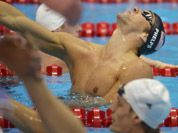 United States` Michael Phelps celebrates winning gold in the men`s 4x200-meter freestyle relay swimming final at the Aquatics Centre in the Olympic Park during the 2012 Summer Olympics in London.