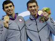 United States` Michael Phelps poses with his medal for the men`s 4x200-meter freestyle relay swimming final at the Aquatics Centre in the Olympic Park during the 2012 Summer Olympics in London.