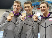 United States Michael Phelps, second from left, pose with his gold medal after their win in the men`s 4 x 200-meter freestyle relay at the Aquatics Centre in the Olympic Park during the 2012 Summer Olympics in London.