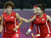 South Korean players celebrate a goal by Cheon Seul-ki (13) during their women`s hockey preliminary match against Japan at the 2012 Summer Olympics.
