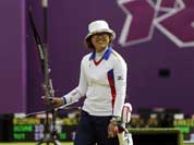 Japan`s Miki Kanie smiles after finishing a round during the individual archery competition at the 2012 Summer Olympics.