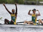 South Africa`s, from left, Sizwe Ndlovu, John Smith, Mathew Brittain and James Thompson celebrate after winning the gold medal for the lightweight men`s rowing four in Eton Dorney, near Windsor, England, at the 2012 Summer Olympics.