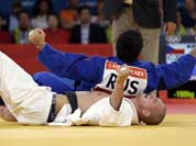 Czech Republic`s Lukas Krpalek, in white, competes against Russia`s Tagir Khaibulaev during the men`s 100-kg judo competition at the 2012 Summer Olympics.