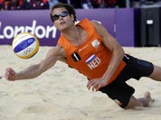Reinder Nummerdor of the Netherlands goes for a dig during a 2 set loss to Latvia during a beach volleyball match at the 2012 Summer Olympics.