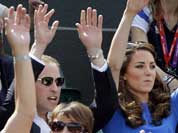 Prince William and Kate, Duchess of Cambridge, join the crowd in doing the wave at a match between Andy Murray of Great Britain and Nicolas Almagro of Spain at the All England Lawn Tennis Club at Wimbledon, in London.