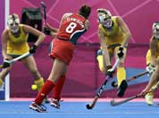 United States` Rachel Dawson (8) attempts to score against Australia during their women`s hockey preliminary match against the United States at the 2012 Summer Olympics.